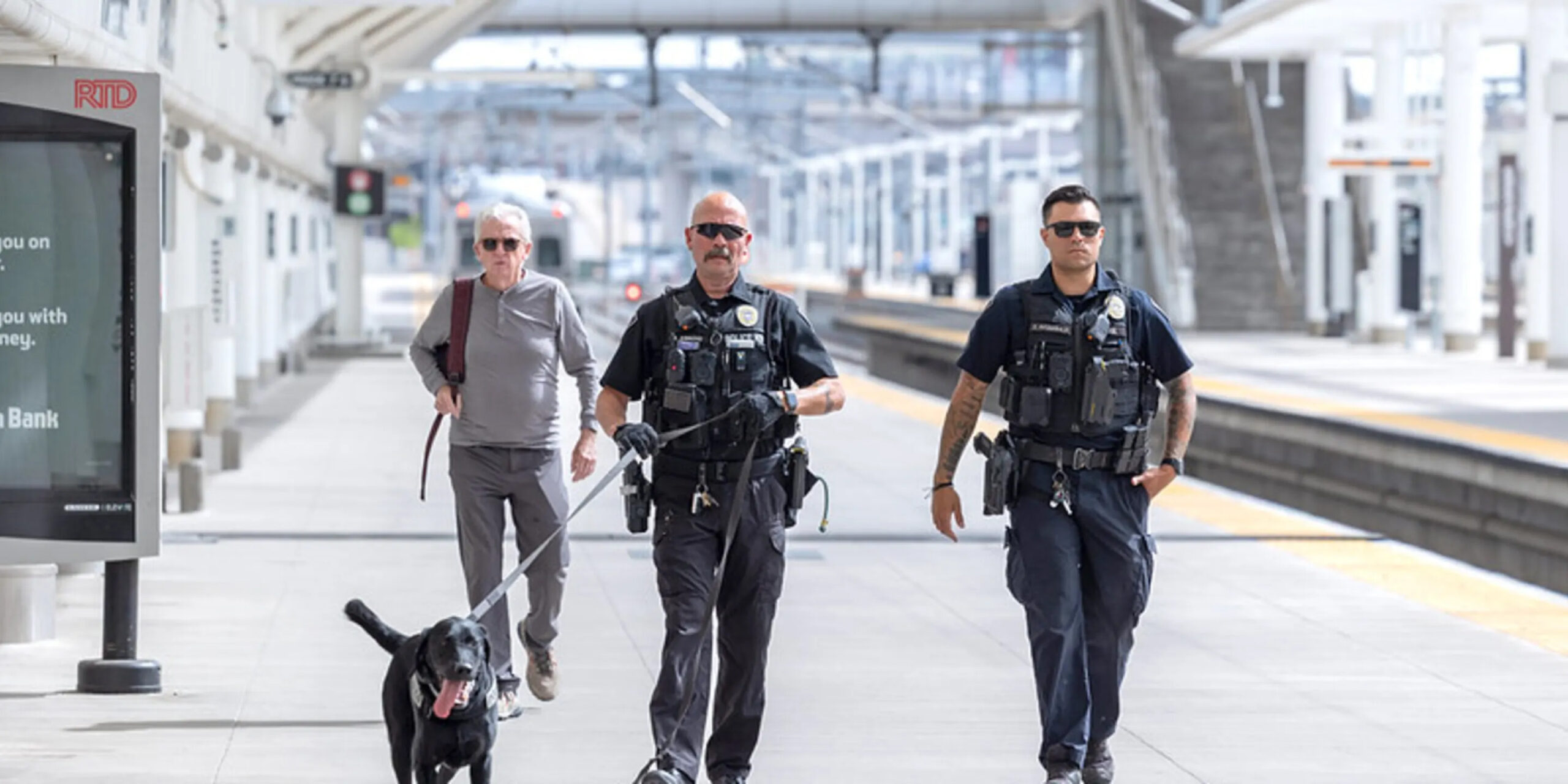Two officers patrol a station