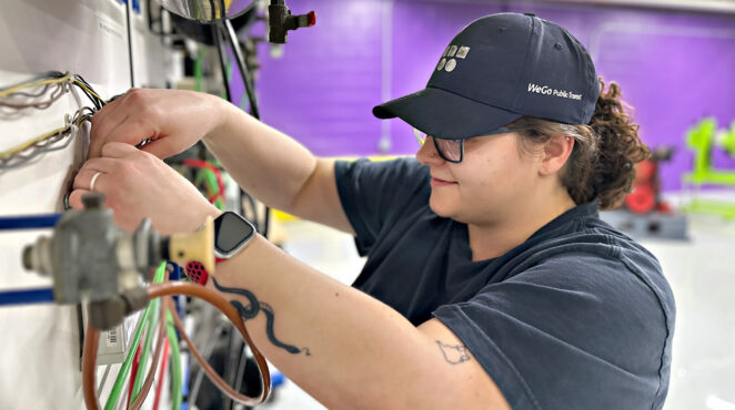 Woman working on machinery