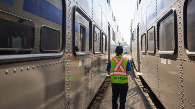Alstom employee between two trains