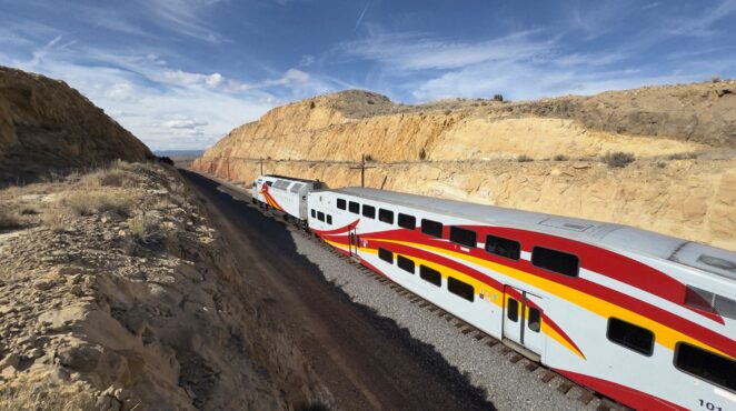 Rail runner train going through the desert