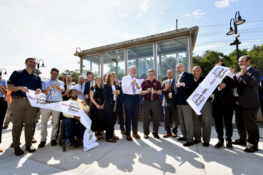 NYMTA leaders and local officials cut a ribbon for the opening on the LIRR station.