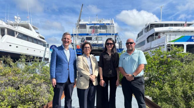 U.S. Rep. Anna Paulina Luna poses with PSTA leaders and others in front of three boats.