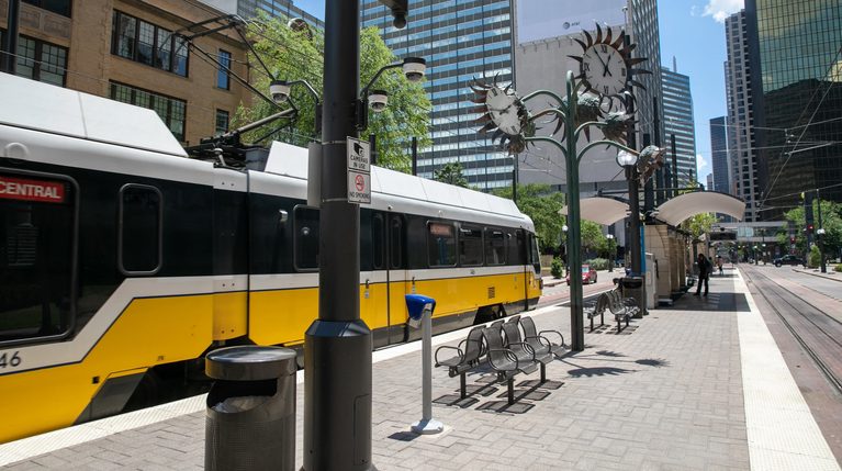 DART light rail train at a city station.