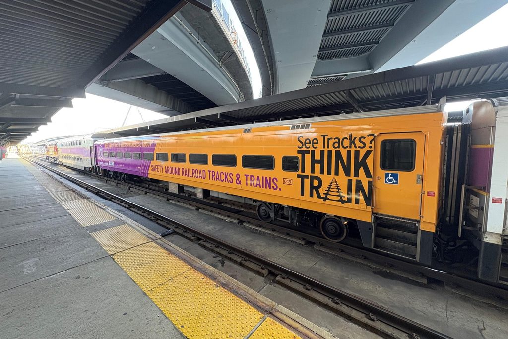 MBTA train with See Tracks? Think Train messaging.