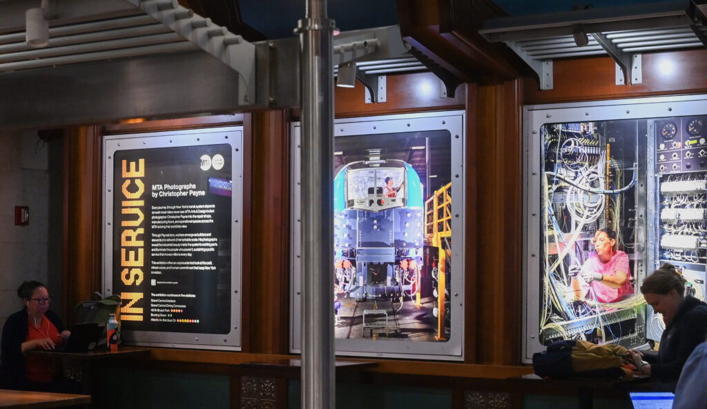 Photo displays at a NYMTA station.