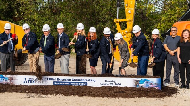 Trinity Metro leaders and others break ground.